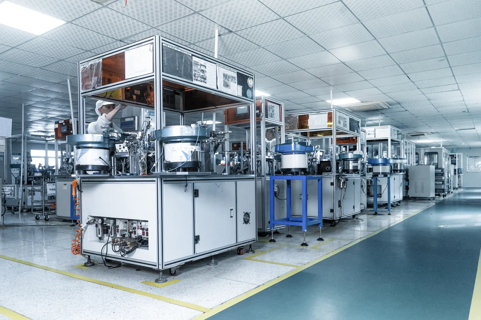 Automated assembly line with vibratory bowl feeders — production facility scene shared by our supply partner